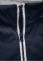 Bunda PitBull West Coast v tmavě modrém provedení s bílým lemováním zipů, integrovaná kapuce s šedou podšívkou a vysoký stojáček který Vás chrání před větrem